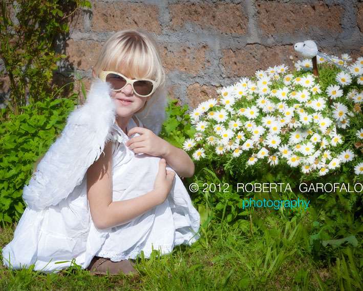 Fotografia di bambina con margherite - Ritratto ambientato